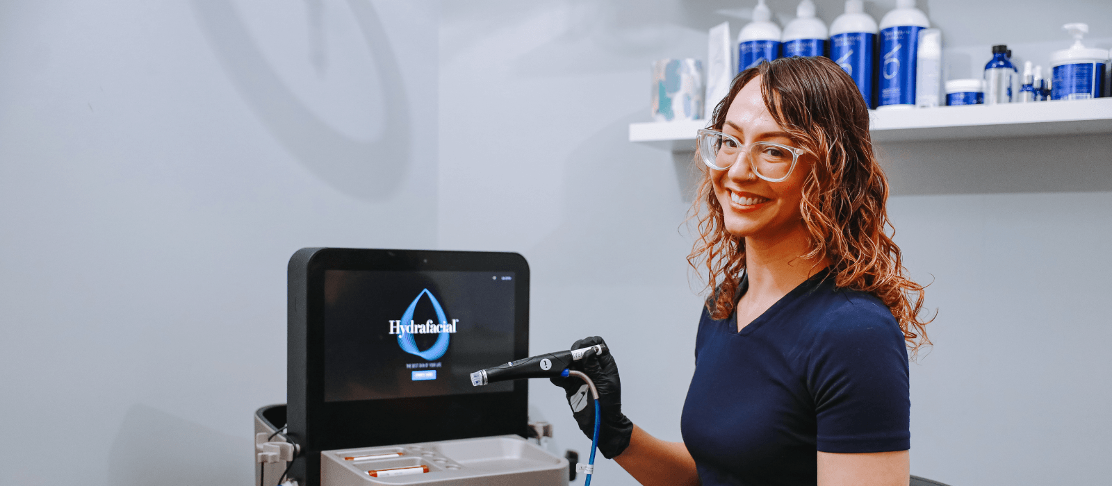 esthetician with facial tool